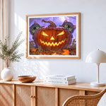 Two cute black cats hiding behind a jacko lantern paint by numbers artwork displayed on wall as home decor