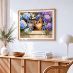 Two cute kittens in blue hydrangeas cross stitch artwork displayed on wall as home decor