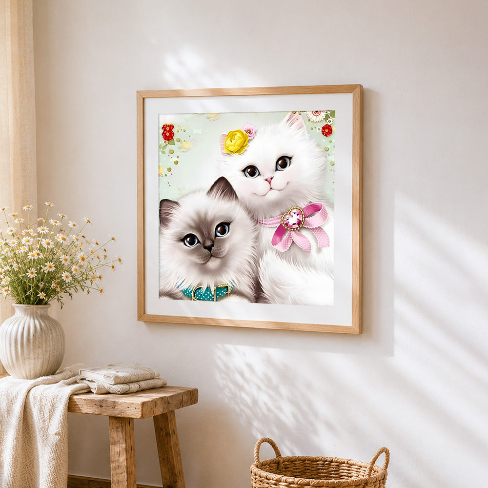 Two fluffy kittens portrait cross stitch artwork displayed on wall as home decor