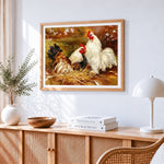 Two hens on a straw nest cross stitch artwork displayed on wall as home decor