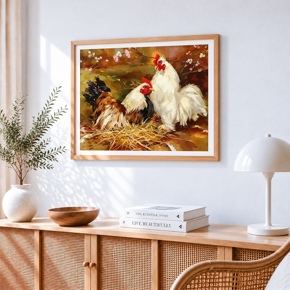 Two hens on a straw nest cross stitch artwork displayed on wall as home decor
