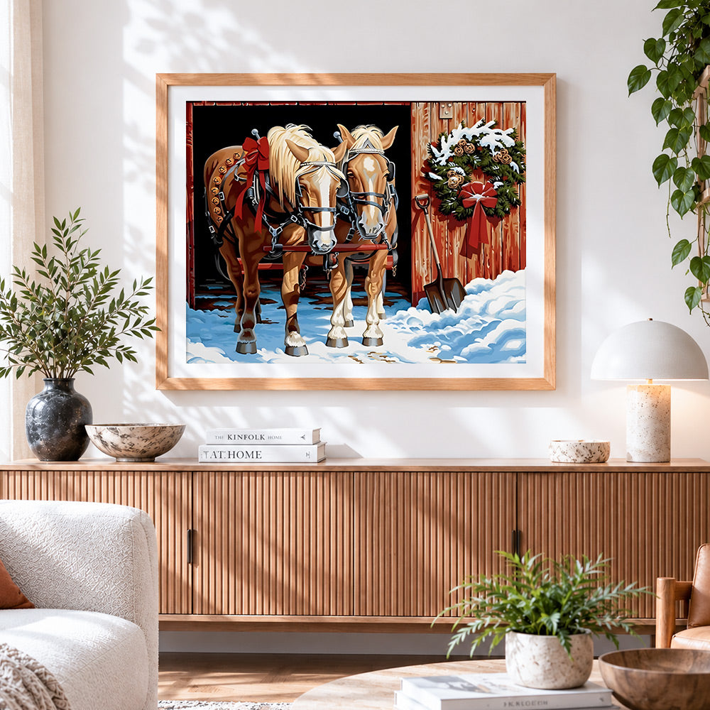 Finished two horses in the snow with christmas wreath cross stitch artwork displayed