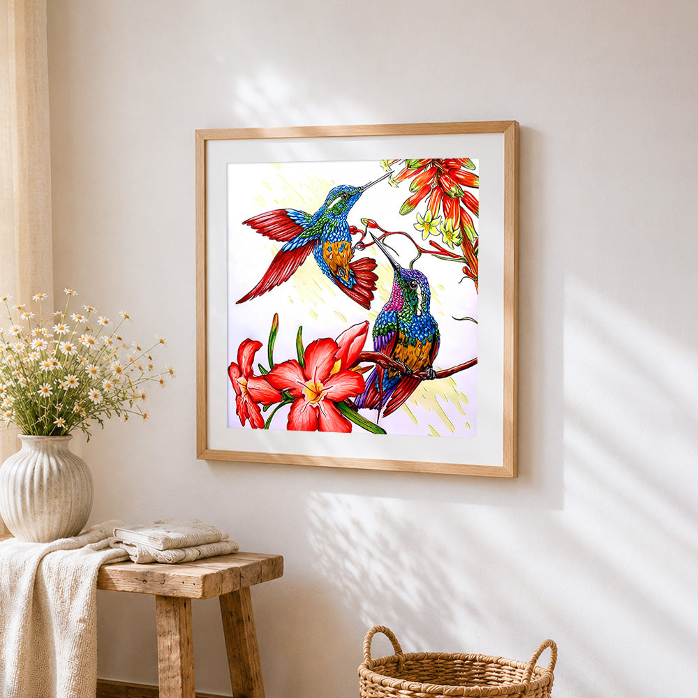 Two hummingbirds and red flowers cross stitch artwork displayed on wall as home decor