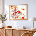 Two koi swimming among pebbles and autumn leaves cross stitch artwork displayed on wall as home decor