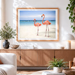Finished two pink flamingos on tropical beach cross stitch artwork displayed