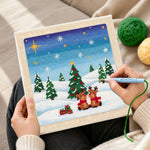 Creating handmade two reindeers in snow punch needle artwork