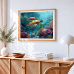 Two sea turtles swimming in a coral reef cross stitch artwork displayed on wall as home decor