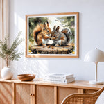 Two squirrels sharing nuts cross stitch artwork displayed on wall as home decor