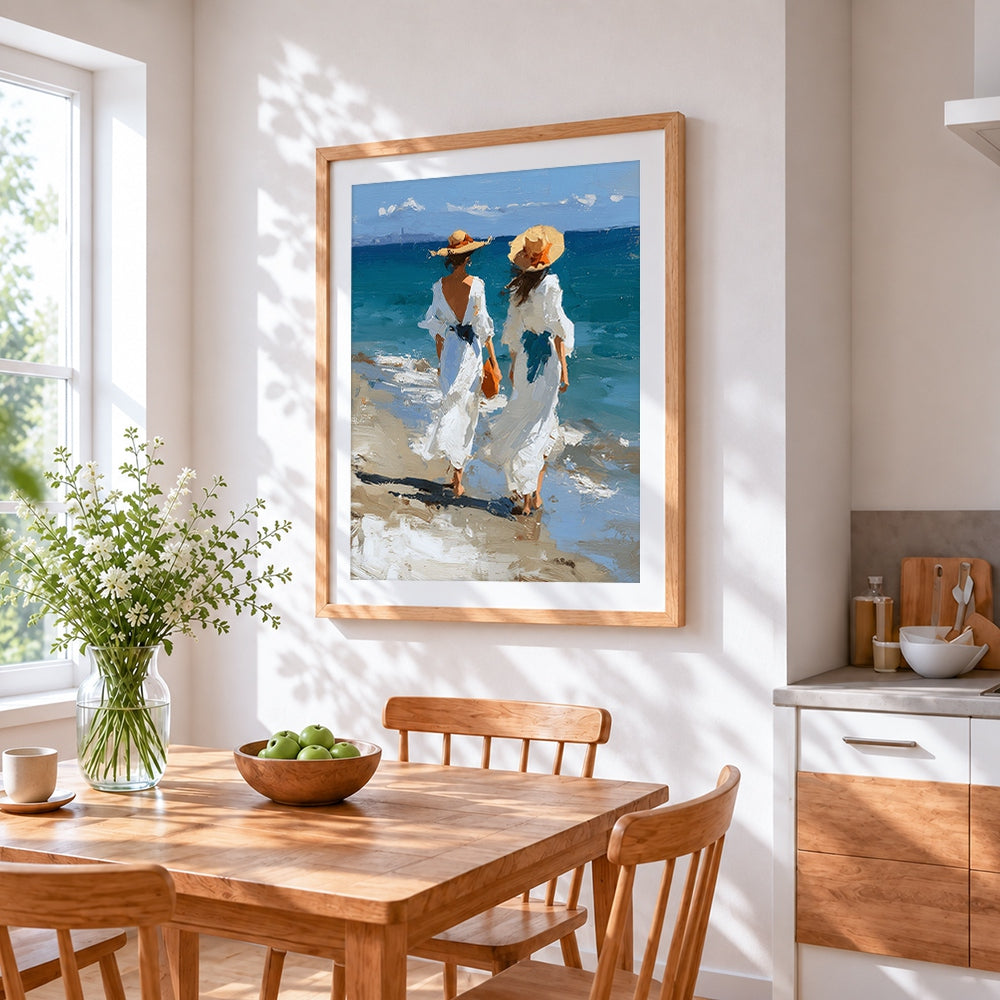 Two women in white dresses at the beach cross stitch artwork displayed on wall as home decor