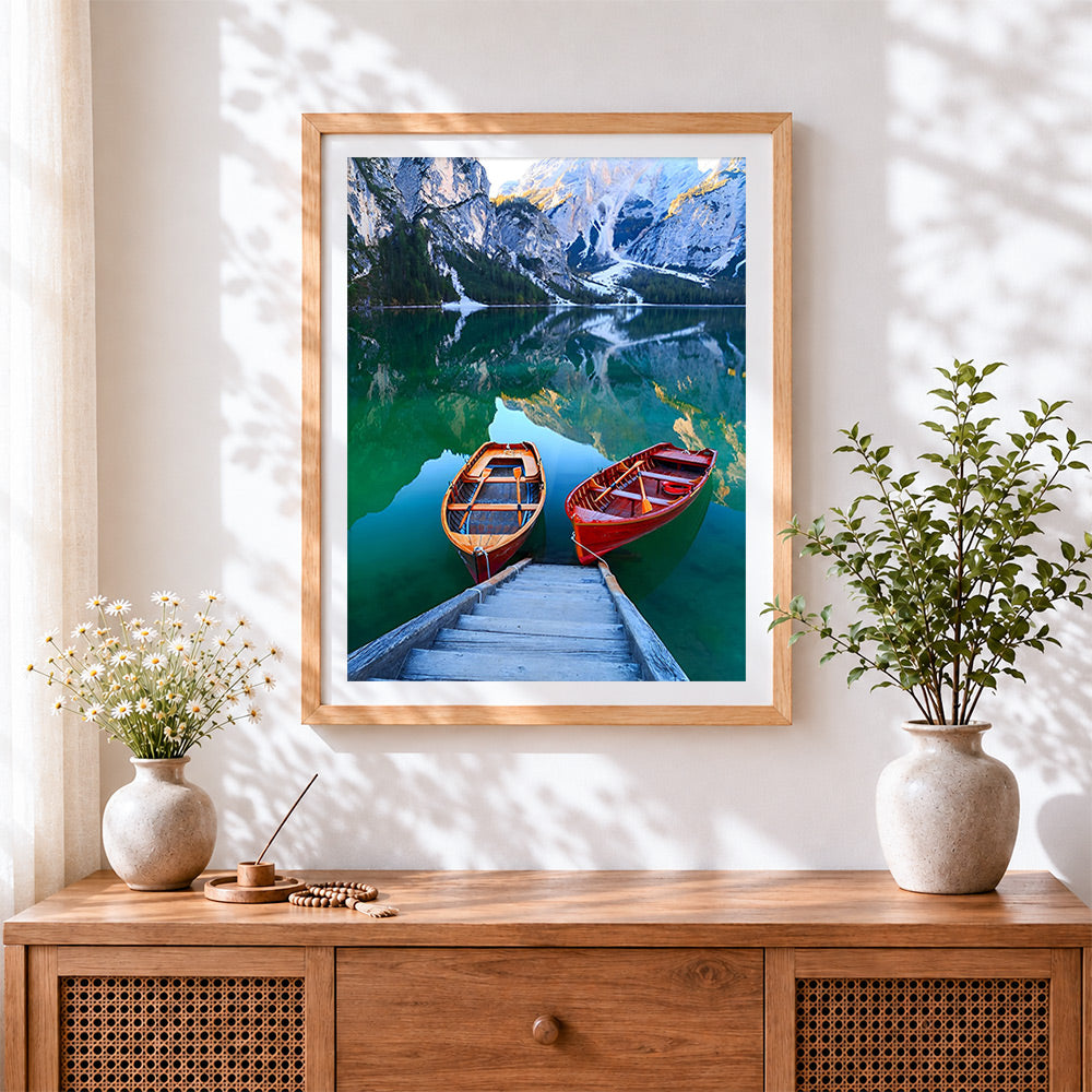 Finished two wooden boats on a turquoise lake cross stitch artwork displayed