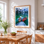 Two wooden boats on a turquoise lake cross stitch artwork displayed on wall as home decor