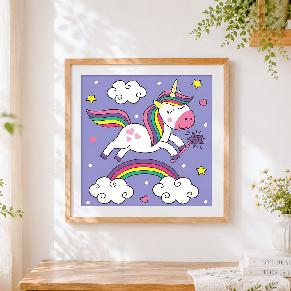 Finished unicorn with magic wand and rainbow cross stitch artwork displayed