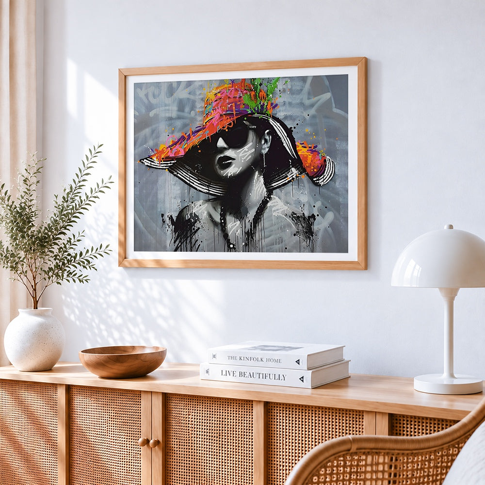 Urban graffiti portrait with colourful hat cross stitch artwork displayed on wall as home decor
