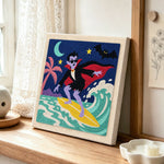 Vampire surfing punch needle artwork displayed on a table
