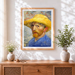 Finished van gogh self-portrait with straw hat cross stitch artwork displayed