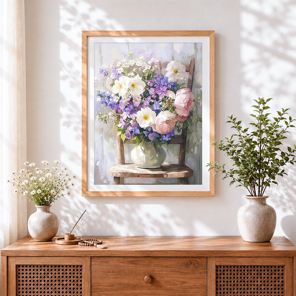 Finished vase of flowers on a wooden chair cross stitch artwork displayed