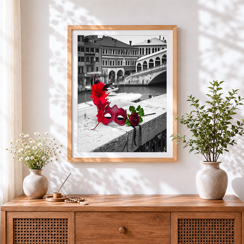 Finished venice mask and red rose cross stitch artwork displayed