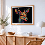 Vibrant abstract deer cross stitch artwork displayed on wall as home decor