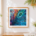 Finished vibrant abstract peacock feather cross stitch artwork displayed