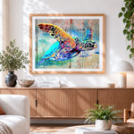 Finished vibrant artistic sea turtle cross stitch artwork displayed