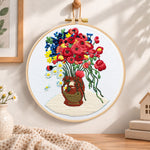 Vibrant bouquet in vase embroidery hoop wall art displayed as warm and cosy handmade home decor