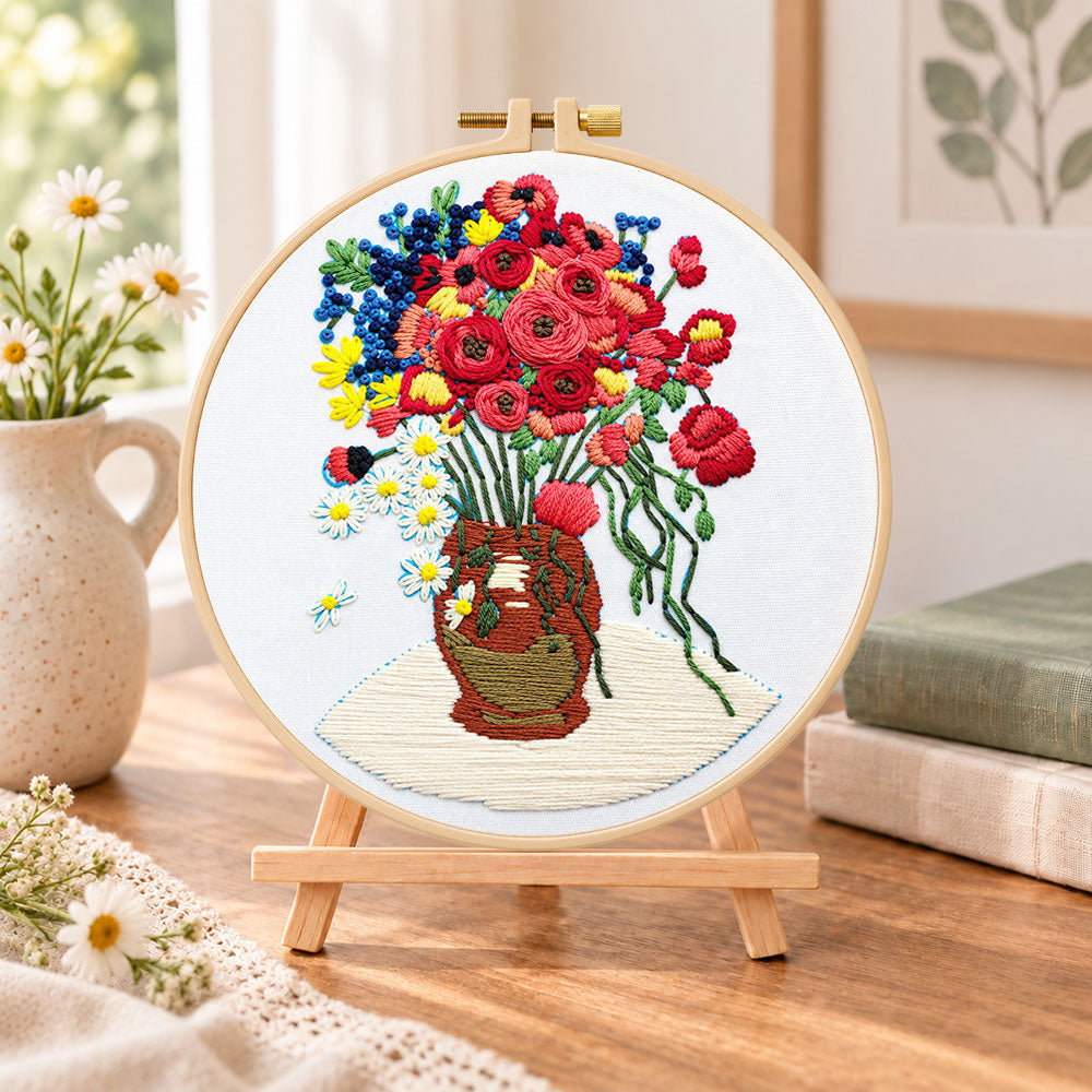 Vibrant bouquet in vase embroidery kit finished hoop displayed on a wooden stand as cosy tabletop decor