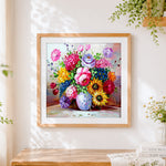 Finished vibrant bouquet still life cross stitch artwork displayed