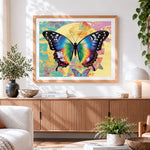 Finished vibrant butterfly and full moon cross stitch artwork displayed
