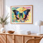 Vibrant butterfly and full moon cross stitch artwork displayed on wall as home decor