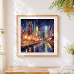 Finished vibrant city lights cross stitch artwork displayed