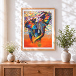Finished vibrant expressionist elephant cross stitch artwork displayed