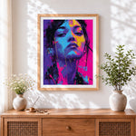 Finished vibrant female portrait cross stitch artwork displayed