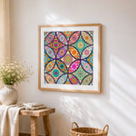 Vibrant floral mandala collage cross stitch artwork displayed on wall as home decor