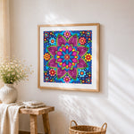 Vibrant floral mandala cross stitch artwork displayed on wall as home decor