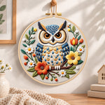 Vibrant floral owl embroidery hoop wall art displayed as warm and cosy handmade home decor