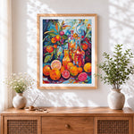 Finished vibrant fruit and bottles cross stitch artwork displayed