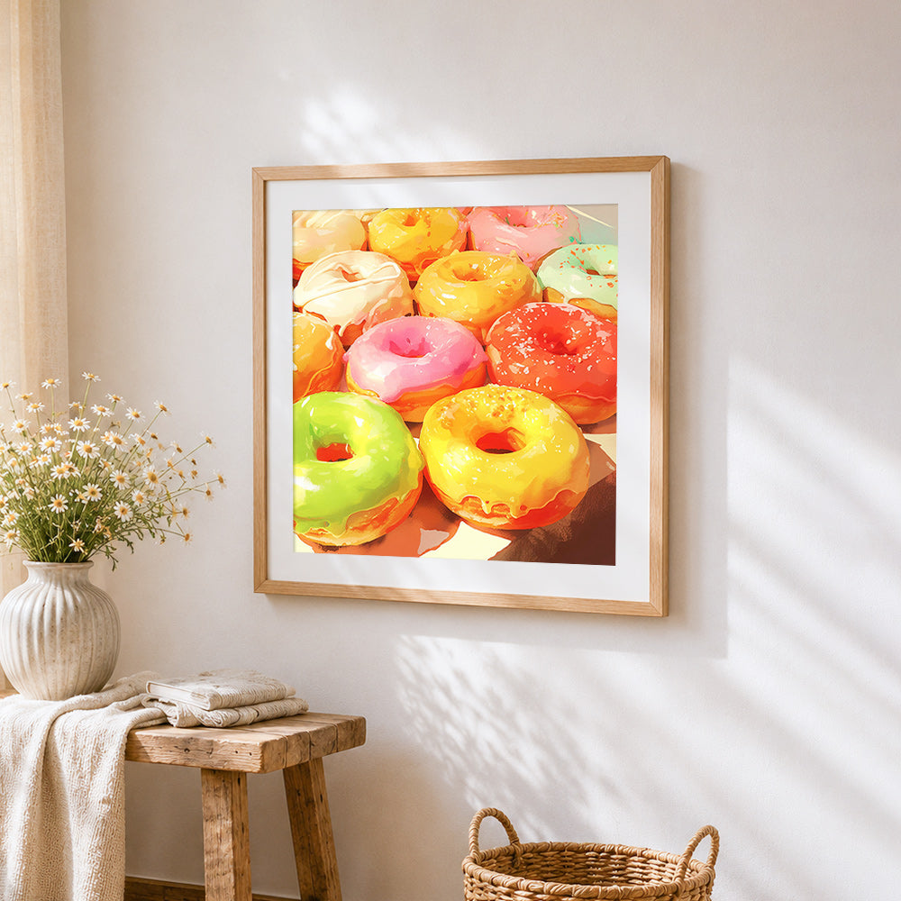 Vibrant glazed donuts cross stitch artwork displayed on wall as home decor