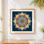 Finished vibrant mandala on a navy background cross stitch artwork displayed