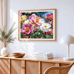Vibrant peony garden in bloom cross stitch artwork displayed on wall as home decor