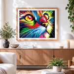 Finished vibrant pop art cat eye close up cross stitch artwork displayed