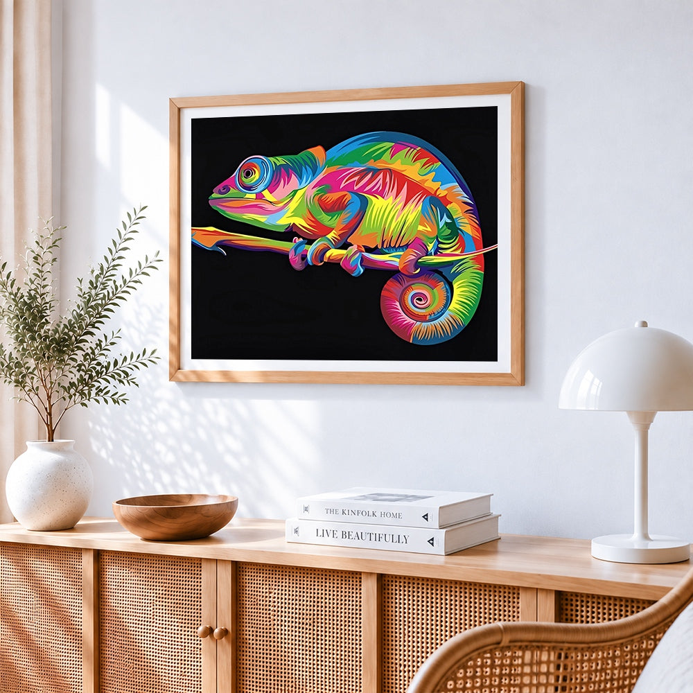 Vibrant pop art chameleon cross stitch artwork displayed on wall as home decor