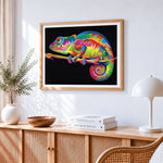 Vibrant pop art chameleon cross stitch artwork displayed on wall as home decor