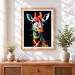 Finished vibrant pop art giraffe portrait cross stitch artwork displayed