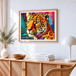 Vibrant pop art leopard portrait cross stitch artwork displayed on wall as home decor