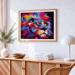 Vibrant pop art lion in the dark cross stitch artwork displayed on wall as home decor