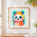 Finished vibrant rainbow panda cross stitch artwork displayed