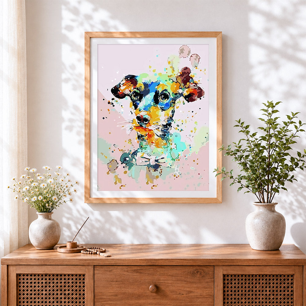 Finished vibrant splatter jack russell terrier cross stitch artwork displayed