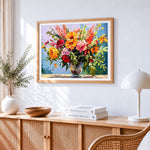 Vibrant summer bouquet in glass vase cross stitch artwork displayed on wall as home decor