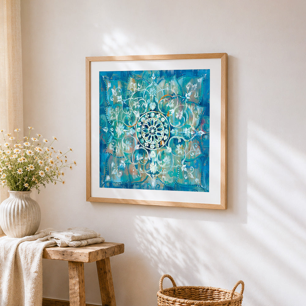 Vibrant turquoise mandala cross stitch artwork displayed on wall as home decor