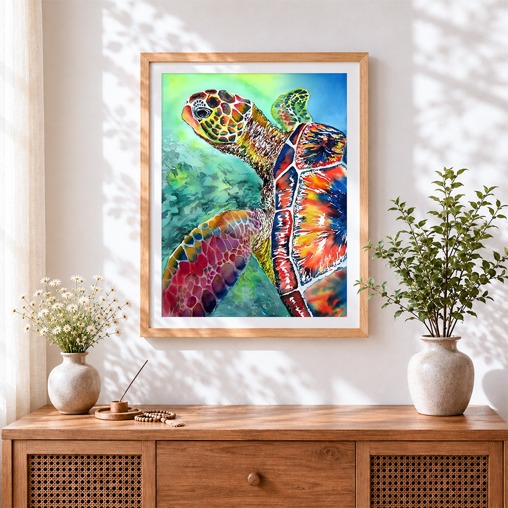 Finished vibrant watercolour sea turtle close up cross stitch artwork displayed